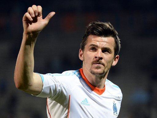 Joey Barton waves at the Velodrome stadium in Marseille, southeastern France on April 5, 2013