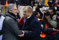 Real Madrid's Jose Mourinho (L) greets Galatasaray's Fatih Terim ahead of their Champions League match on April 9, 2013