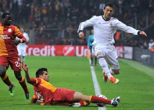 Real Madrid&#039;s Cristiano Ronaldo (R) is pictured during their Champions League match against Galatasaray on April 9, 2013