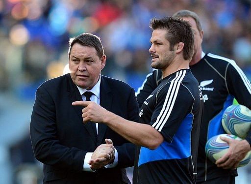 All Blacks coach Steve Hansen (L) talks to Richie McCaw ahead of an International Rugby Union match on November 17, 2012