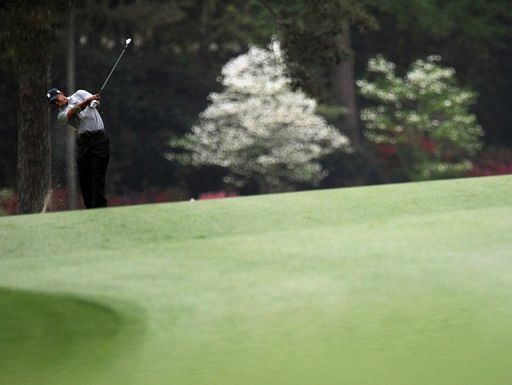 Tiger Woods plays during the first round of the 77th Masters at Augusta National Golf Club on April 11, 2013 in Augusta