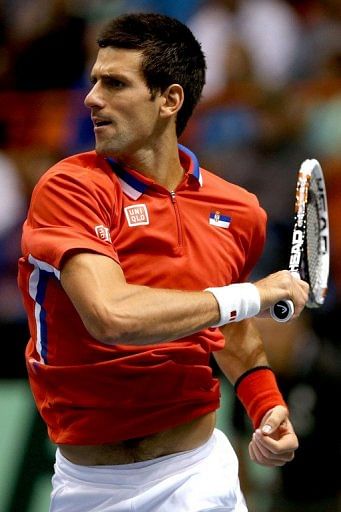 Novak Djokovic returns a shot to Sam Querrey during their Davis Cup tie in Boise, Idaho, on April 7, 2013