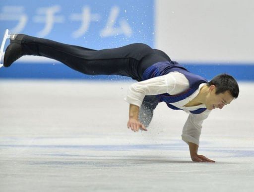 Canada&#039;a Patrick Chan falls during his performance in the men&#039;s free skate in Tokyo on April 12, 2013
