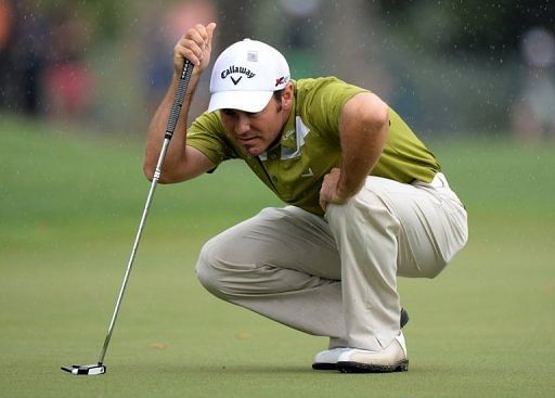 Trevor Immelman of South Africa plays in the rain during the second round of the 77th Masters, April 12, 2013 in Augusta