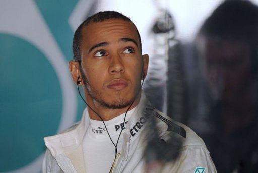 Britain&#039;s Lewis Hamilton prepares for the third practice session of the F1 Chinese GP in Shanghai on April 13, 2013