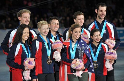 The US team celebrate their win at the World Team Trophy figure skating competition in Tokyo on April 13, 2013