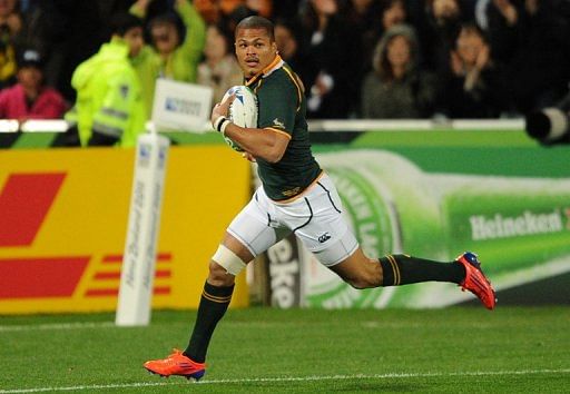 Juan de Jongh runs to score a try during a match in Auckland on September 22, 2011