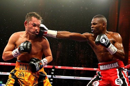 Guillermo Rigondeaux lands a punch on Nonito Donaire during their WBO/WBA junior featherweight  bout on April 13, 2013