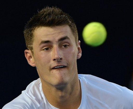 Australia&#039;s Bernard Tomic plays against Roger Federer at the Australian Open in Melbourne on January 19, 2013