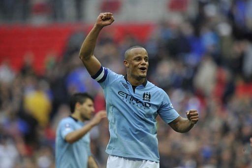 Manchester City&#039;s Vincent Kompany celebrates after winning the FA Cup semi-final at Wembley on April 14, 2013