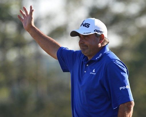 Angel Cabrera of Argentina waves during the third round on April 13, 2013 in Augusta, Georgia