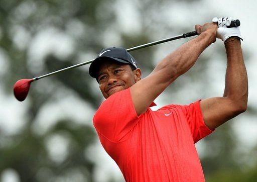Tigers Woods hits a shot during the final round on April 14, 2013 in Augusta