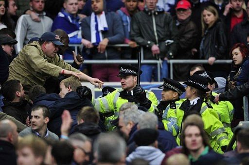 Millwall fans clash with police at Wembley Stadium in north London on April 13, 2013