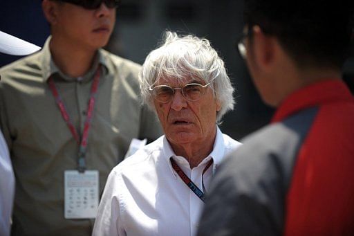 Formula One supremo Bernie Ecclestone (C), pictured in Shanghai, on April 14, 2013