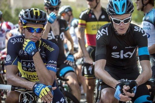 Chris Froome (right) and Alberto Contador wait for the start of the third stage of the Tour of Oman on February 13, 2013