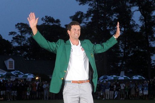 Adam Scott smiles after being presented with the Green Jacket at Augusta National Golf Club on April 14, 2013