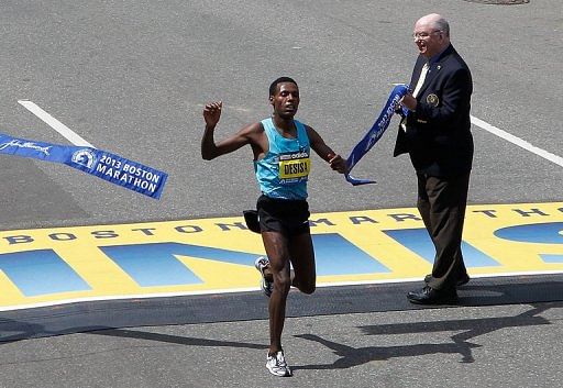 Lelisa Desisa crosses the finish line to win the men&#039;s division of the 117th Boston Marathon on April 15, 2013 in Boston