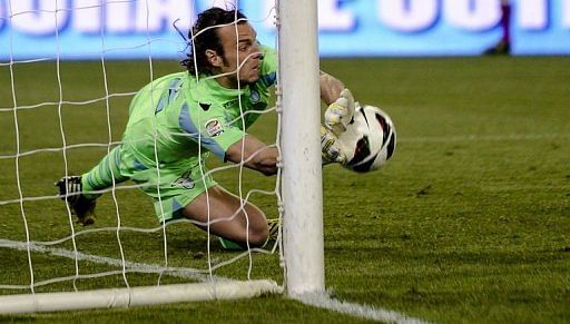 Lazio&#039;s goalkeeper Federico Marchetti makes a save on April 15, 2013 at Rome&#039;s Olympic stadium