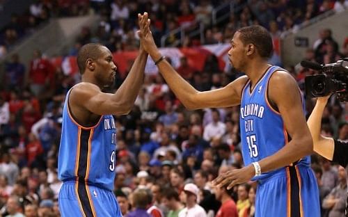 Oklahoma City Thunder's Kevin Durant (R) Serge Ibaka high five during a game in Los Angeles on March 3, 2013