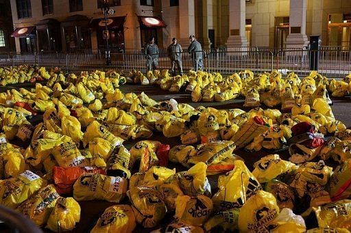 Unclaimed finish line bags are viewed near the scene of a twin bombing at the Boston Marathon on April 16, 2013