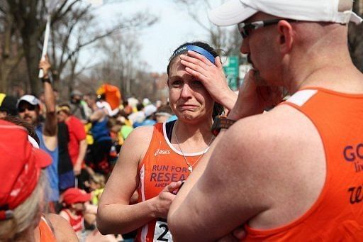 A runner reacts after two bombs exploded during the Boston Marathon on April 15, 2013