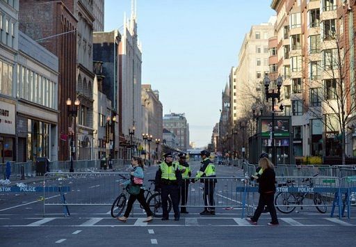 Boston police officers stand at barriers closing off Boylston Street April 16, 2013 in Boston, Massachusetts