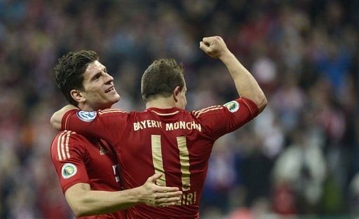 Bayern Munich&#039;s Mario Gomez (L) and Xherdan Shaqiri (R) celebrate in Munich on April 16, 2013