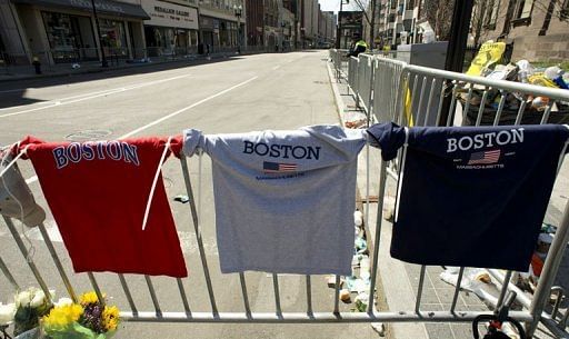 Tributes for victims of the Boston Marathon are laid along Boylston and Arlington Street on April 16, 2013