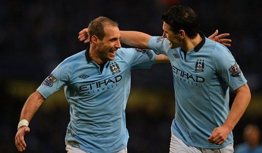 Manchester City&#039;s Pablo Zabaleta (L) and Gareth Barry are pictured during a Premier League match on January 1, 2013