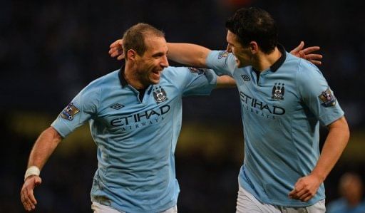 Manchester City&#039;s Pablo Zabaleta (L) and Gareth Barry are pictured during a Premier League match on January 1, 2013