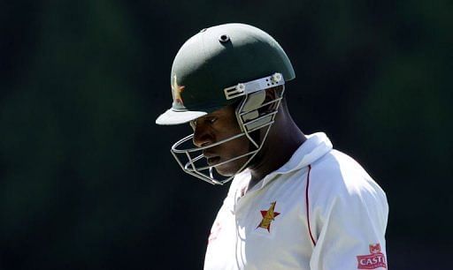 Zimbabwe&#039;s Vusi Sibanda walks off after losing his wicket at the Harare Sports Club on April 17, 2013