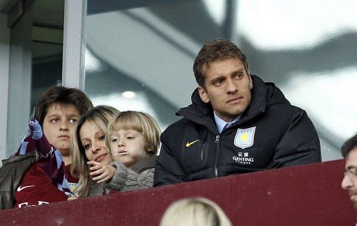 File picture taken on March 31, 2012 shows Aston Villa captain Stiliyan Petrov (R) with his family at Villa Park