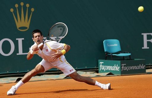 Serbia&#039;s Novak Djokovic hits a return to Russia&#039;s Mikhail Youzhny during a Monte Carlo Masters match on April 17, 2013