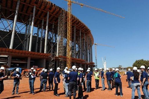 FIFA representatives make an inspection visit on September 9, 2012 to see the Mane Garrincha National Stadium