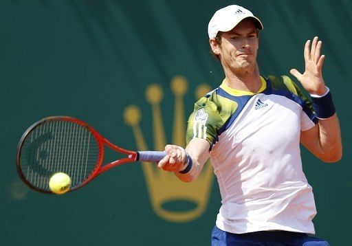 Andy Murray hits a return during his match against Switzerland&#039;s Stanislas Wawrinka in Monaco on April 18, 2013