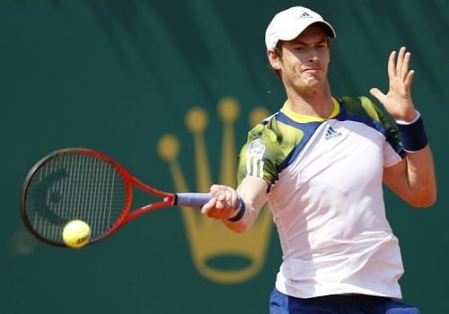 Andy Murray hits a return during his match against Switzerland's Stanislas Wawrinka in Monaco on April 18, 2013