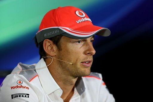 Jenson Button sits during a press conference at the Bahrain International Circuit in Manama on April 18, 2013
