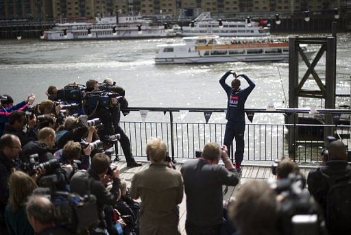 Mo Farah poses for photographers in central London on April 18, 2013 during a photo call ahead of the London marathon