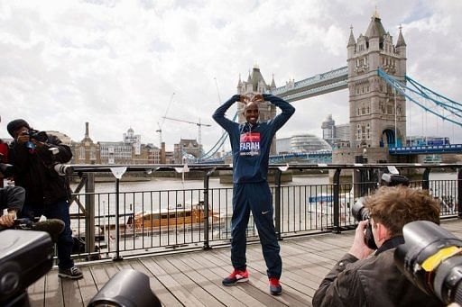 British Olympic double gold medallist Mo Farah poses for photographers in central London on April 18, 2013