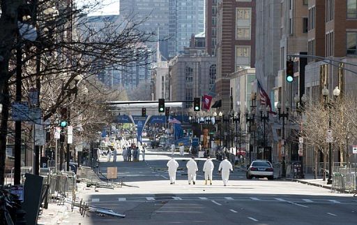 Agents continue to search for evidence on the Boston Marathon route on April 18, 2013 in Boston