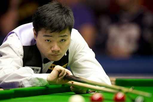 China&#039;s Ding Junhui lines up a shot during The Masters in London on January 13, 2013