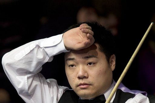 China&#039;s Ding Junhui gestures during The Masters in London on January 13, 2013