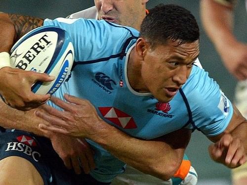 Waratahs' winger Israel Folau tries to dodge a tackle during a Super 15 match on March 15, 2013