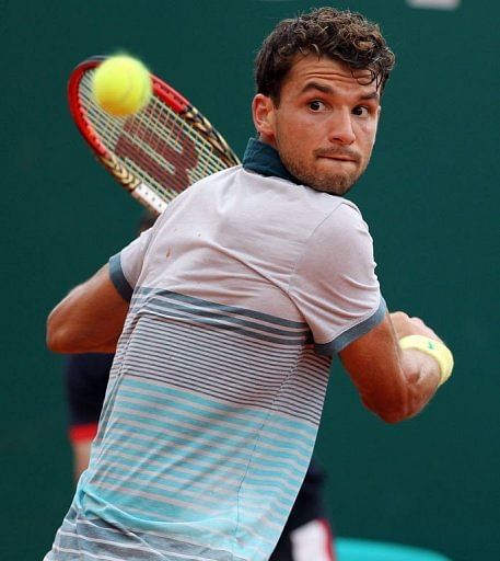 Grigor Dimitrov hits a return to Rafael Nadal during the Monte Carlo Masters in Monaco, on April 19, 2013