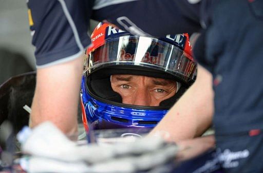 Red Bull Racing&#039;s Australian driver Mark Webber sits in the pits in Manama on April 19, 2013