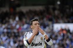 Ozil double sees Madrid past Betis