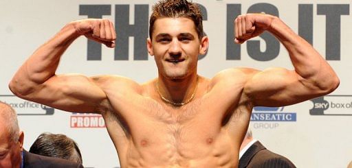 Welsh boxer Nathan Cleverly poses for photographers at a weigh-in on May 20, 2011