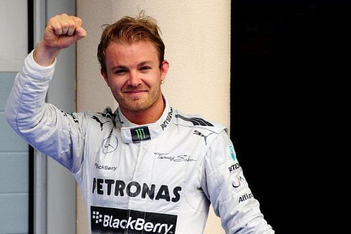 Mercedes driver Nico Rosberg celebrates taking pole position at the Bahrain Grand Prix on April 20, 2013