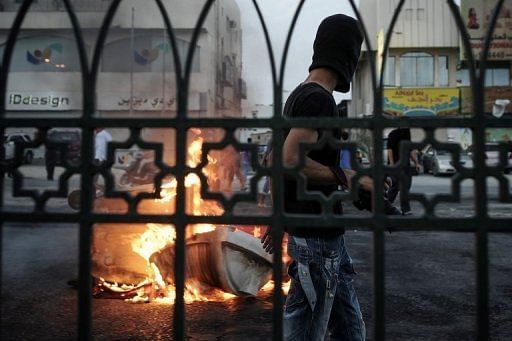 A protester during clashes with riot police following a demonstration on April 19, 2013 in a village west of Manama