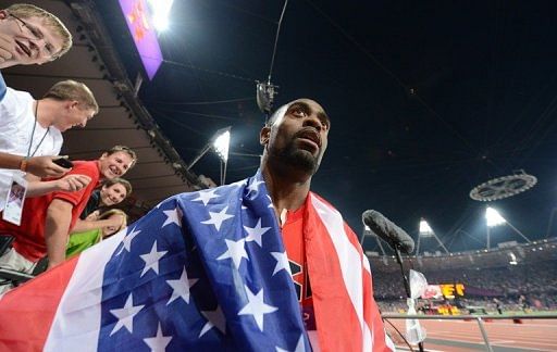 Tyson Gay celebrates with US fans at the London Olympics on August 11, 2012